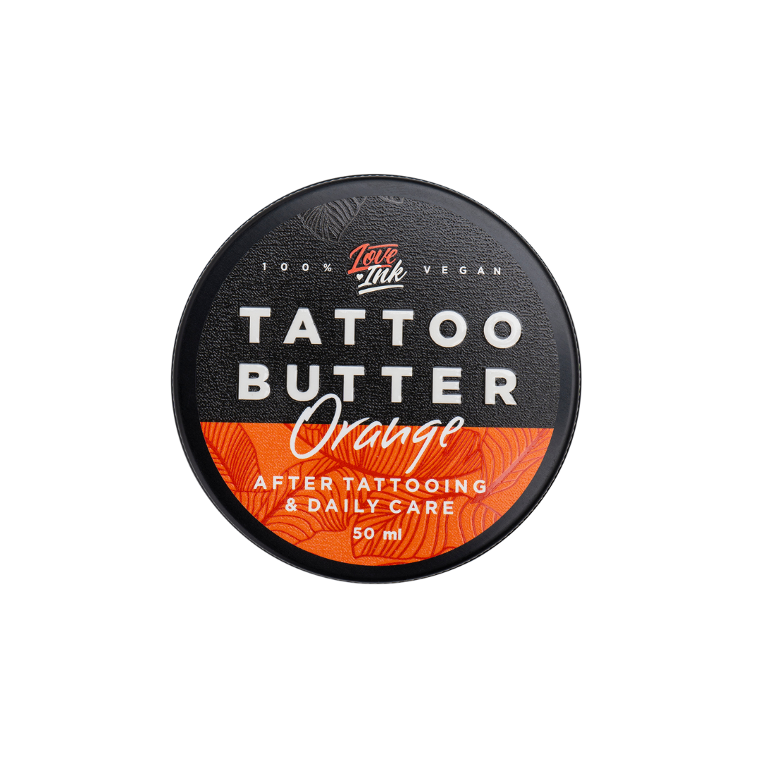 Top view of a 50ml jar of Tattoo Butter Orange by LoveInk. The sleek black and orange packaging highlights its purpose for after tattooing and daily care.