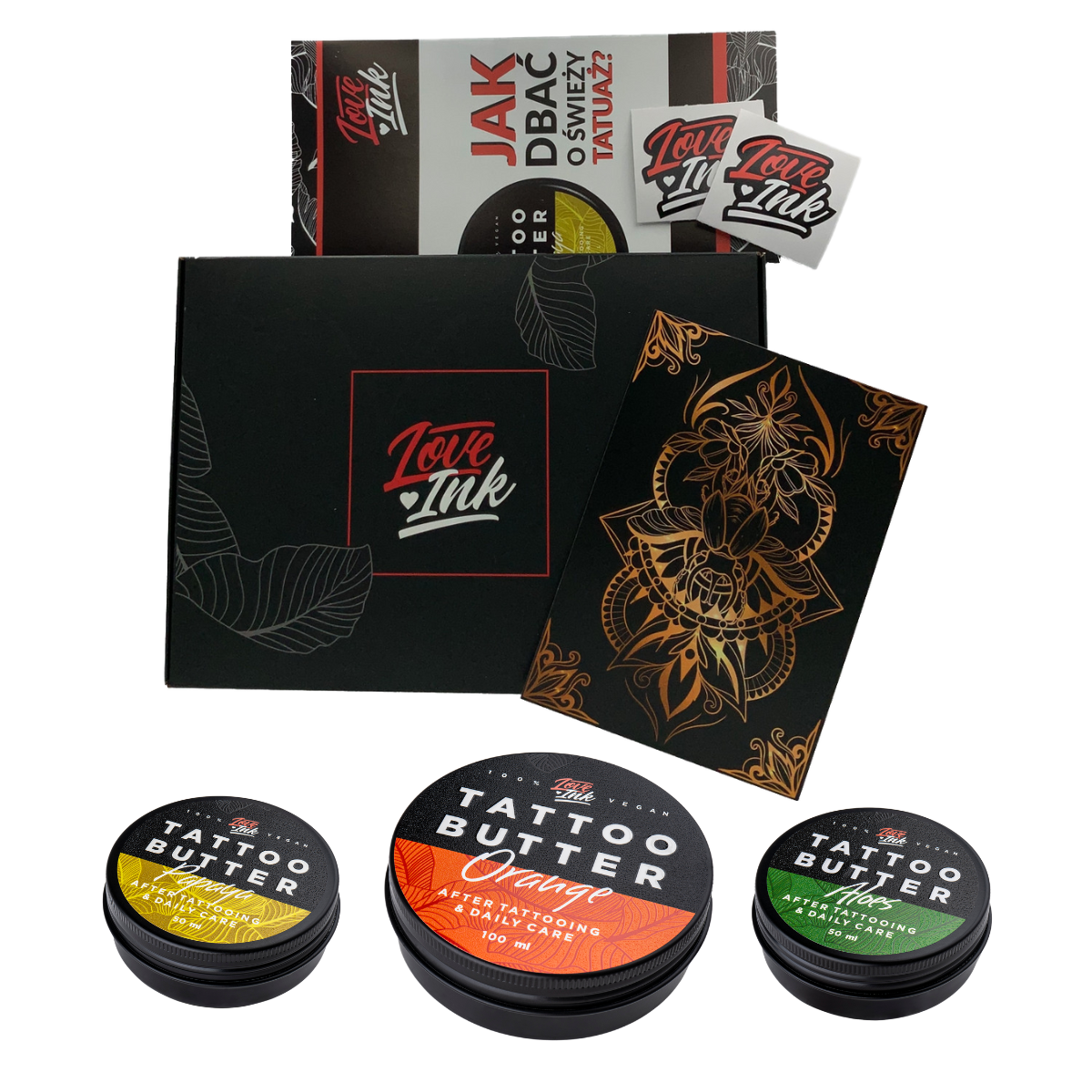 A collection of Love Ink tattoo care products displayed on a transparent background. The items include a black box with the Love Ink logo, a brochure on how to care for a new tattoo, a sticker, a black and gold tattoo design, and three tins of Tattoo Butter in different formulations for daily care.