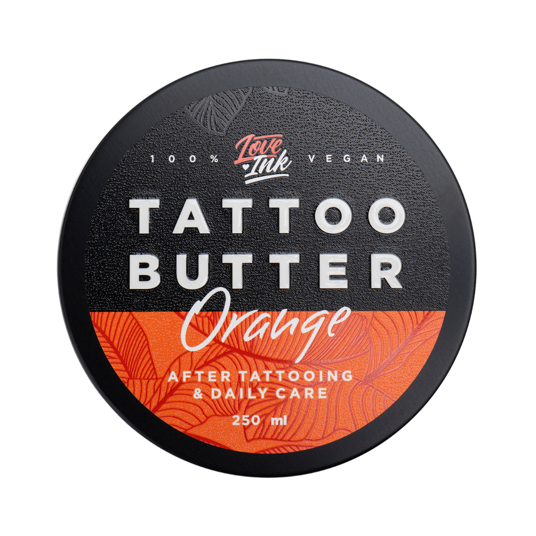 Top view of a 250ml jar of Tattoo Butter Orange by LoveInk. The sleek packaging highlights that it is 100% vegan and suitable for after tattooing and daily care.