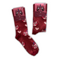 A pair of red socks featuring a cartoon cat with a unicorn horn (Kotorozec) and hearts. The socks are labeled as size EU 36-40.